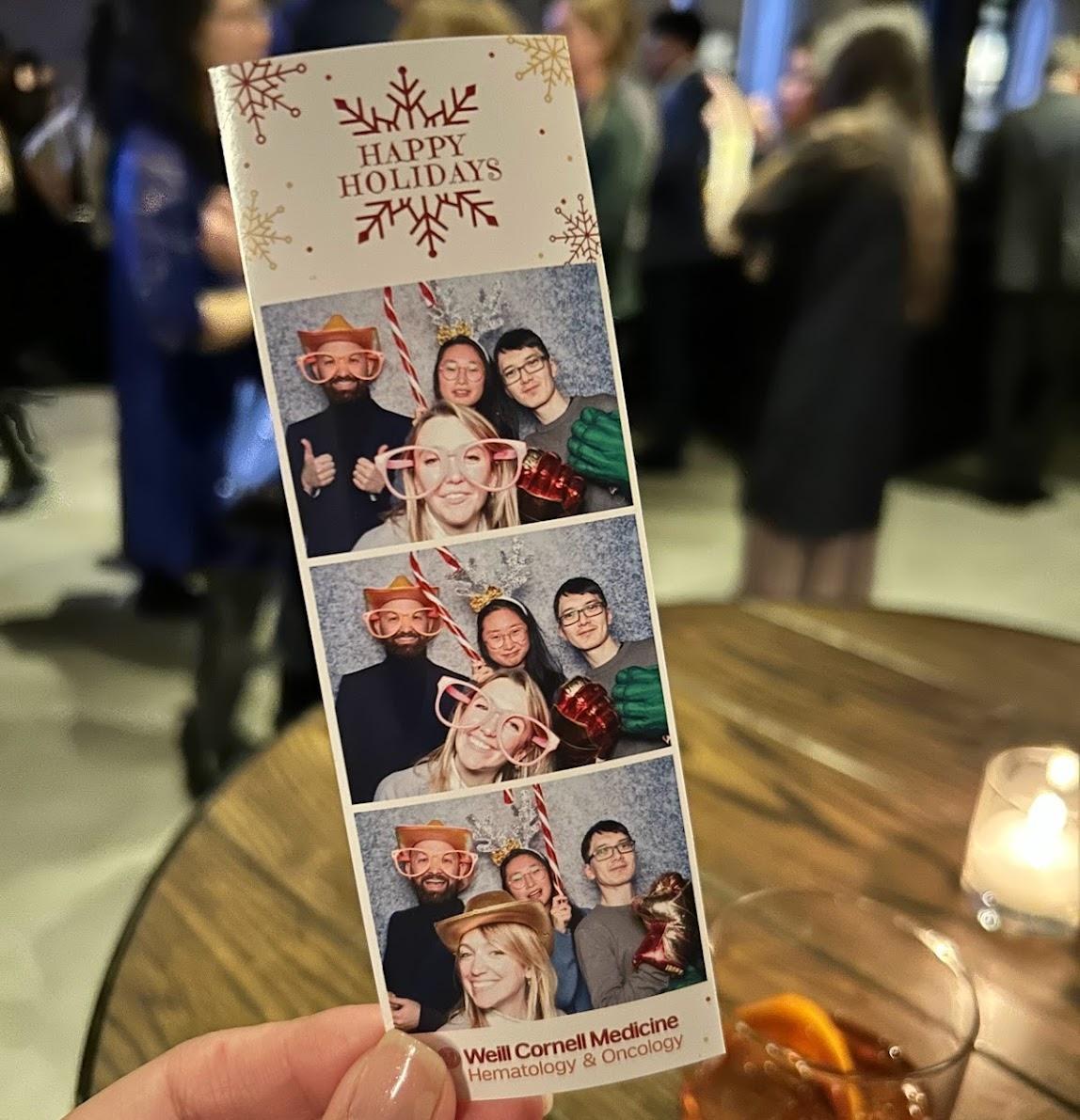 Picture of a photo booth print out with members of the Zappasodi lab