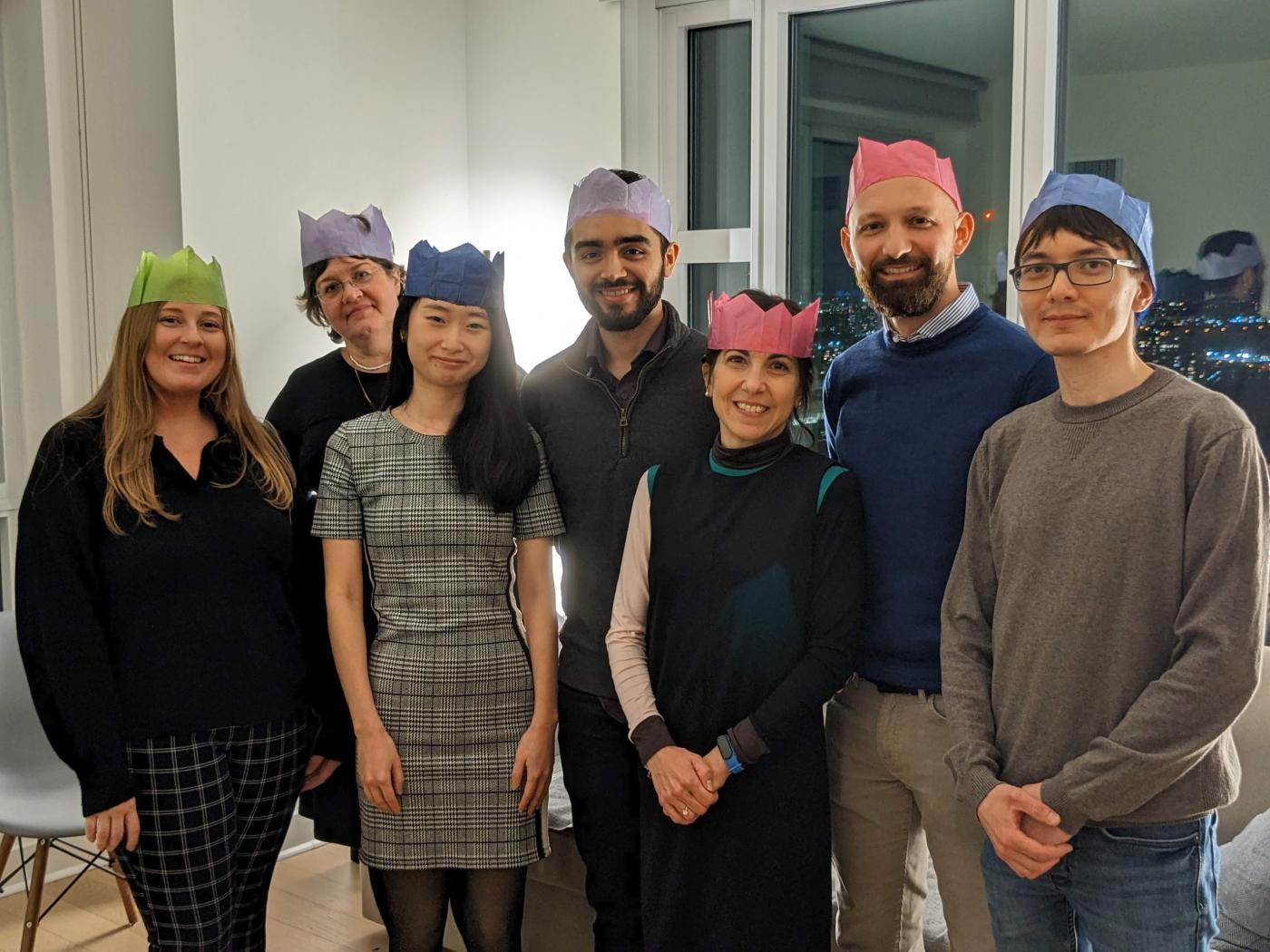 Zappasodi lab members posing for a photo wearing paper crowns